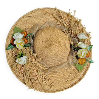 Decorative straw hat with dried flowers