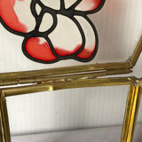 Glass box and hexagonal brass enamelled floral decoration