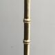 Floor lamp in faux-bamboo style, made of bronze and brass by Jacques Adnet