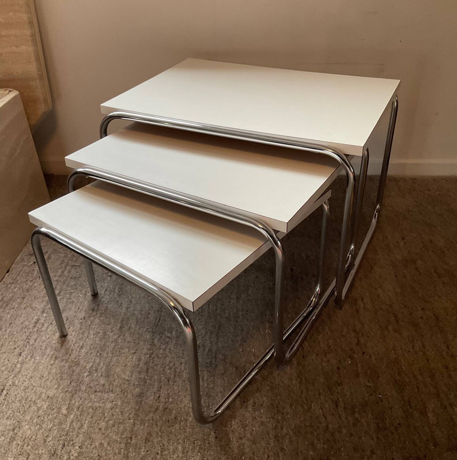 Trio of vintage nesting tables in Formica and chrome metal