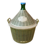 Large green glass lady-Jeanne in a khaki plastic basket, mid-century style.