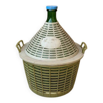 Large green glass lady-Jeanne in a khaki plastic basket, mid-century style.