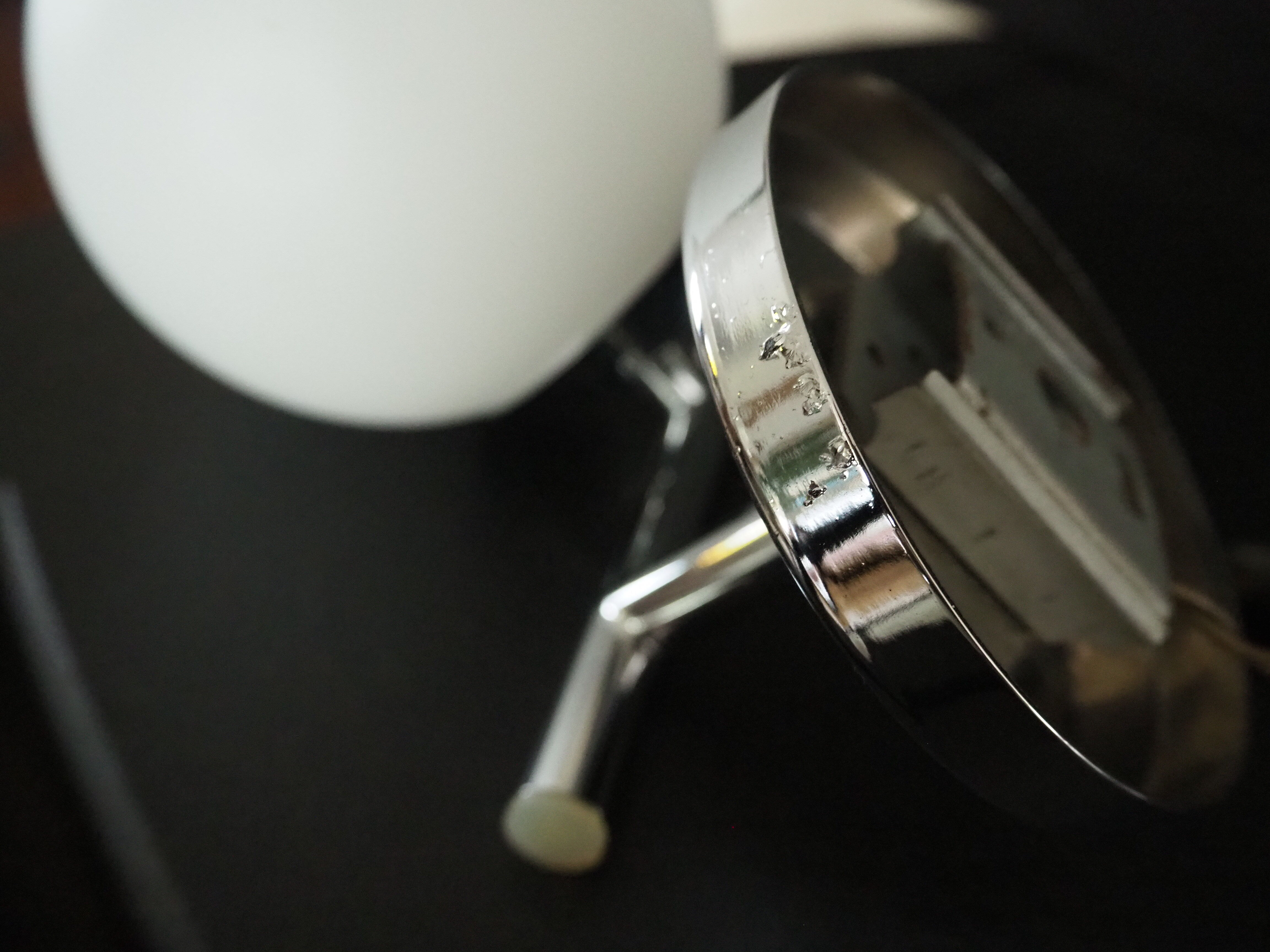 Pair of sconces with an opaline globe and chrome structure from the 1970s