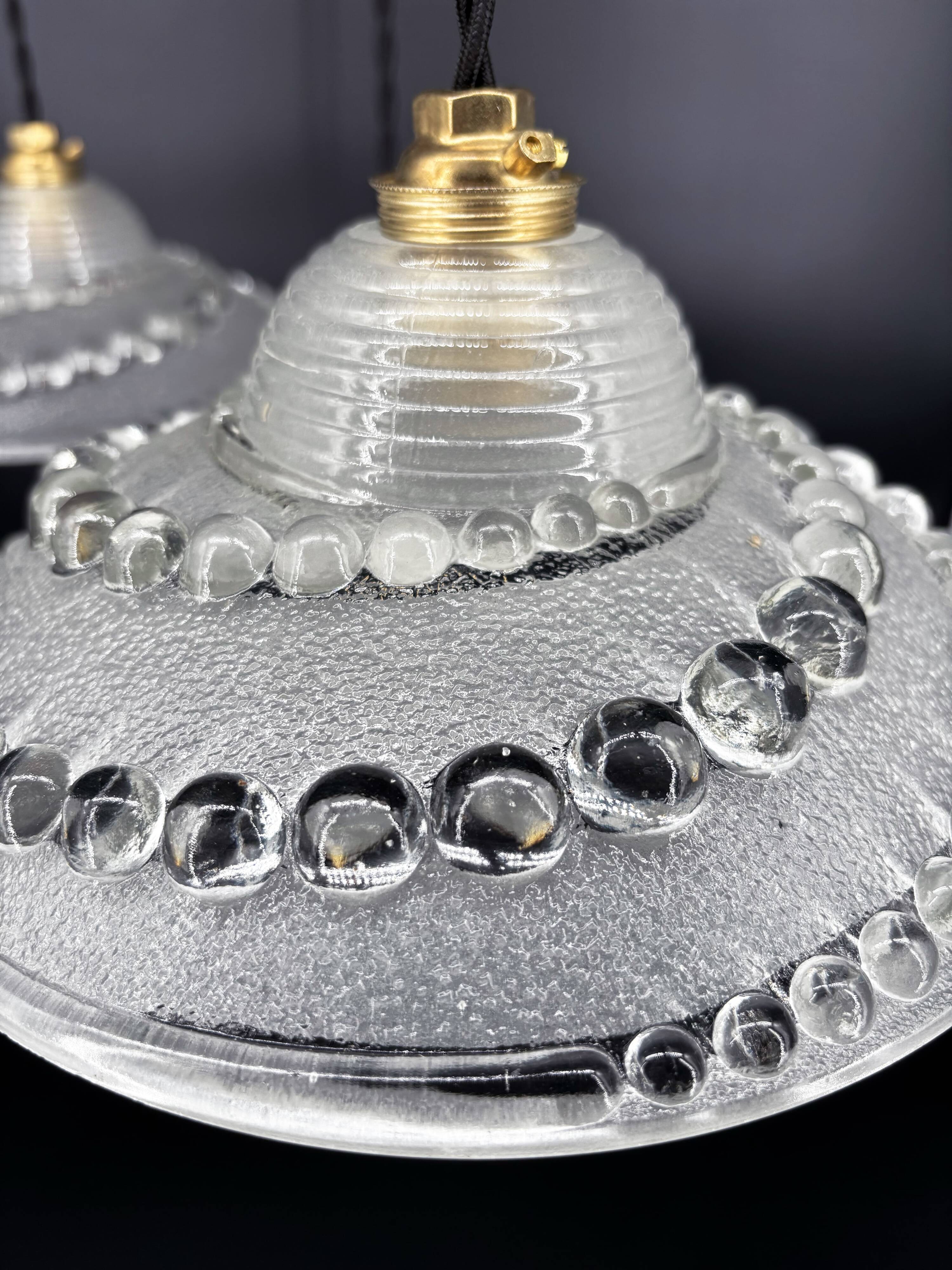 Set of 3 moulded glass pendant lights with cabochons, Art Deco style Ezan.