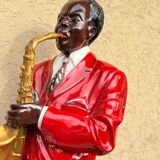 Large black and red jazz figurine in fibreglass, decorative sculpture from the 1960s.