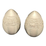 Egg-shaped metal salt and pepper shakers with Asian countryside motif