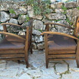 Pair of armchairs in stained wood and leather, 20th century