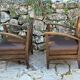 Pair of armchairs in stained wood and leather, 20th century
