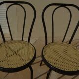 4 Chaises bistrot en métal noir et assise cannage plastique