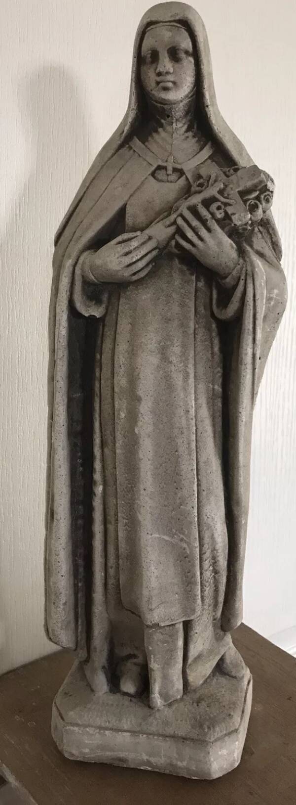 Religious statue of sainte therese of lisieux “the little flower of jesus” in stone