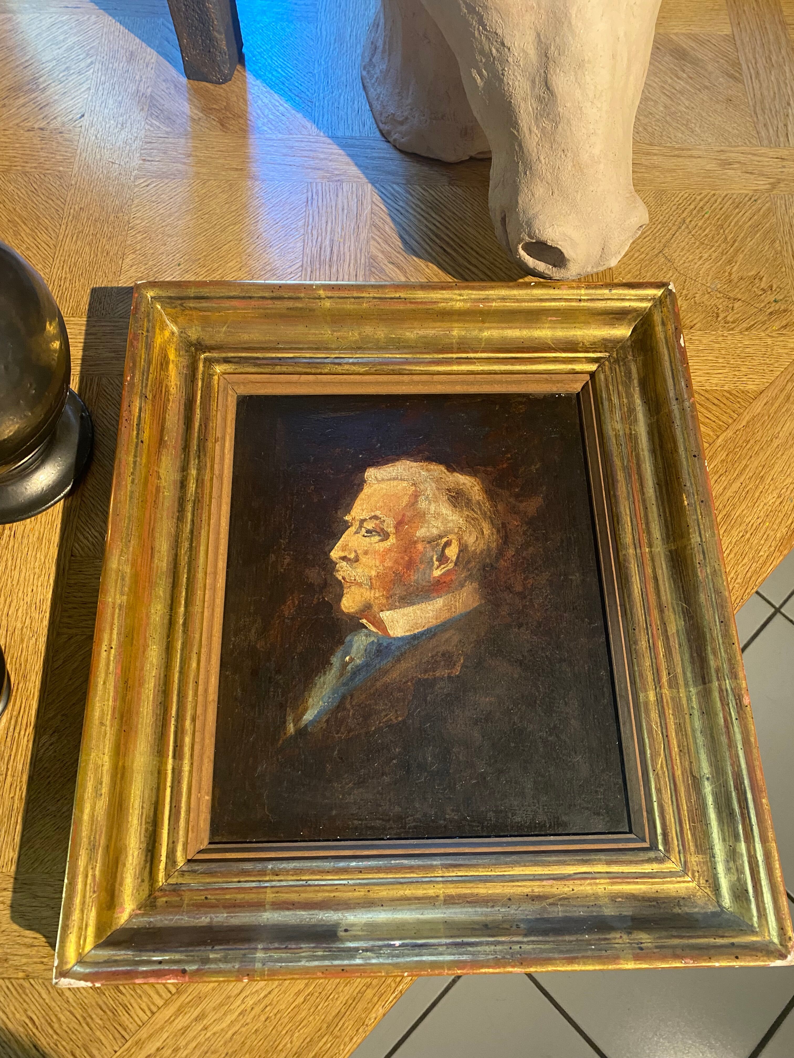 Old portrait in gilded wood