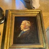 Old portrait in gilded wood