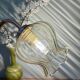 Applique coudée globe vintage en verre ambré