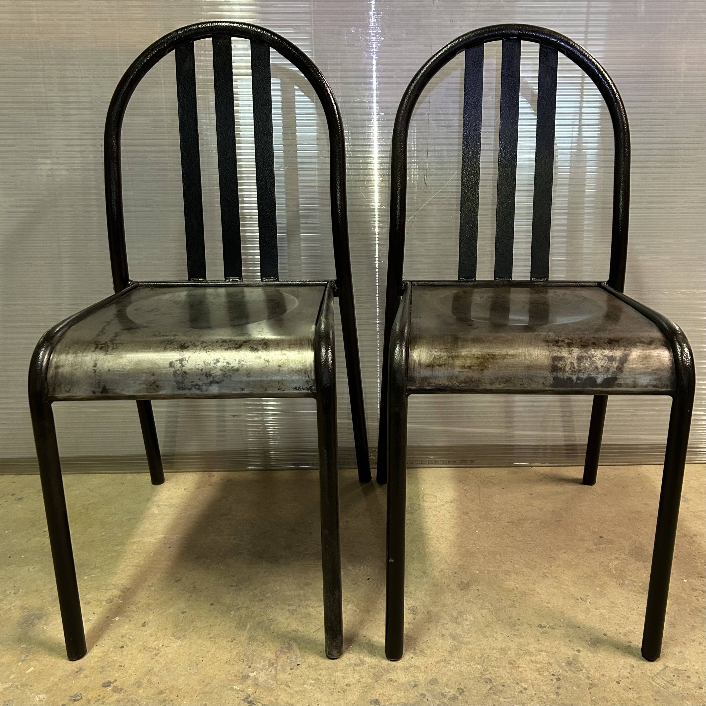 Two vintage slatted chairs.