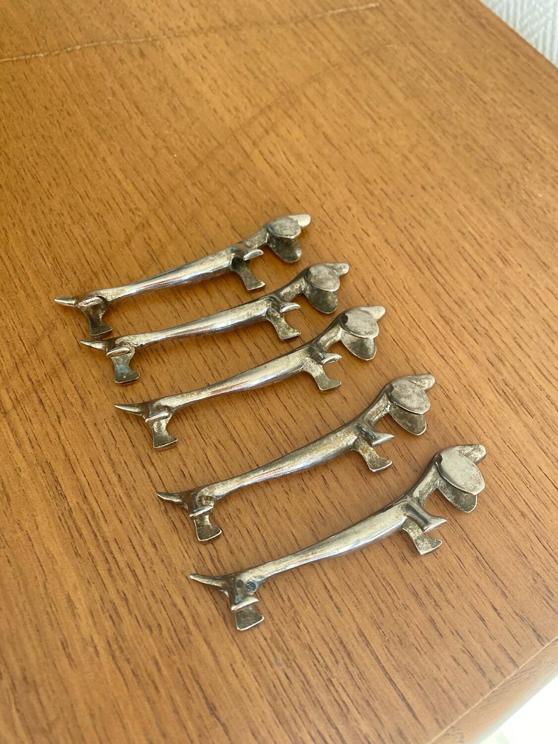 Vintage silver-plated dog knife rests