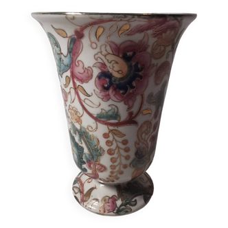 Old vintage vase with floral decor