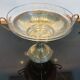 Art Deco brass cup and its engraved saucer.