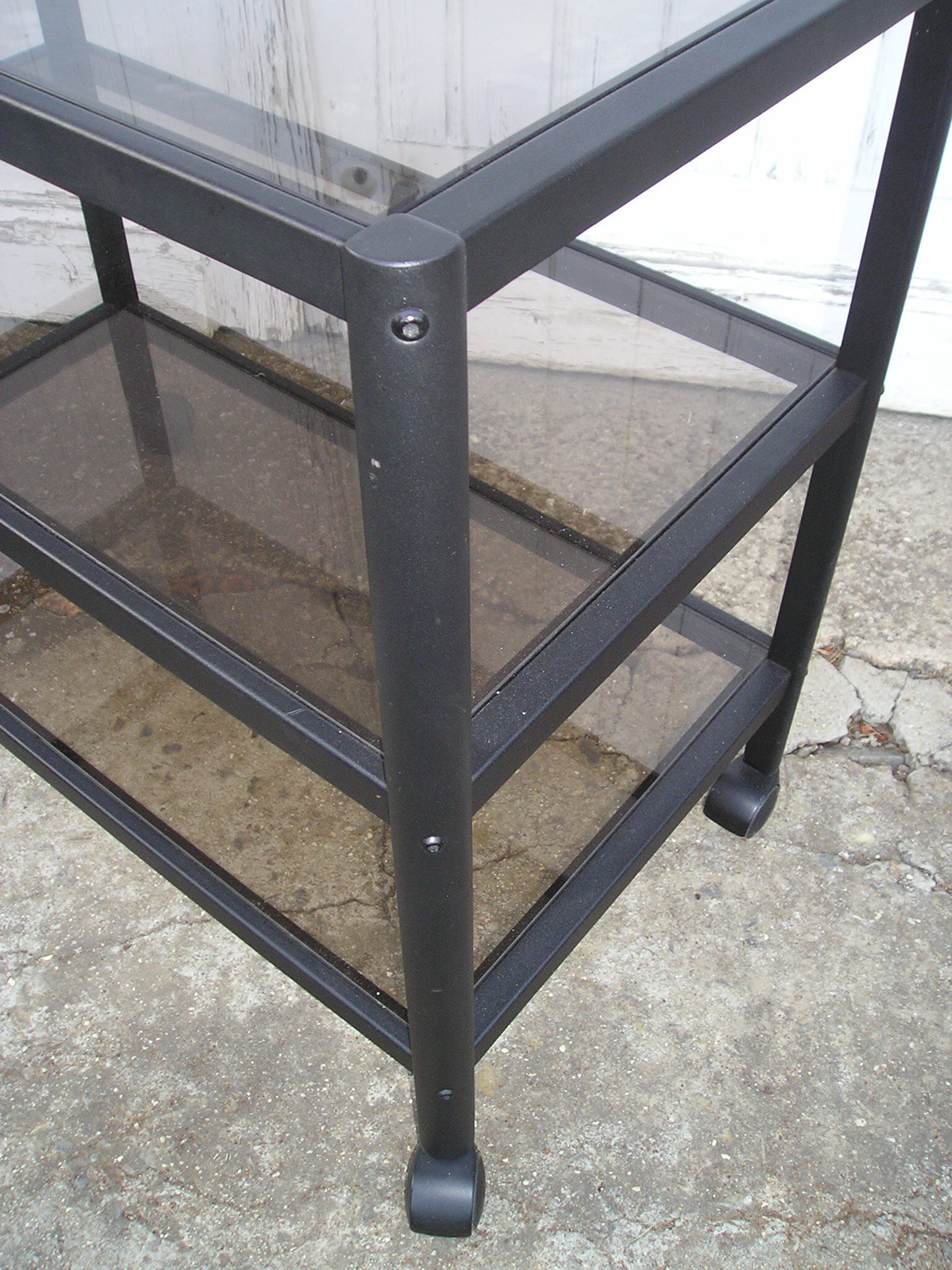 Rolling table serves 3 trays of smoked glass