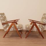 Pair of vintage lounge chairs in brown jacquard fabric and wood.
