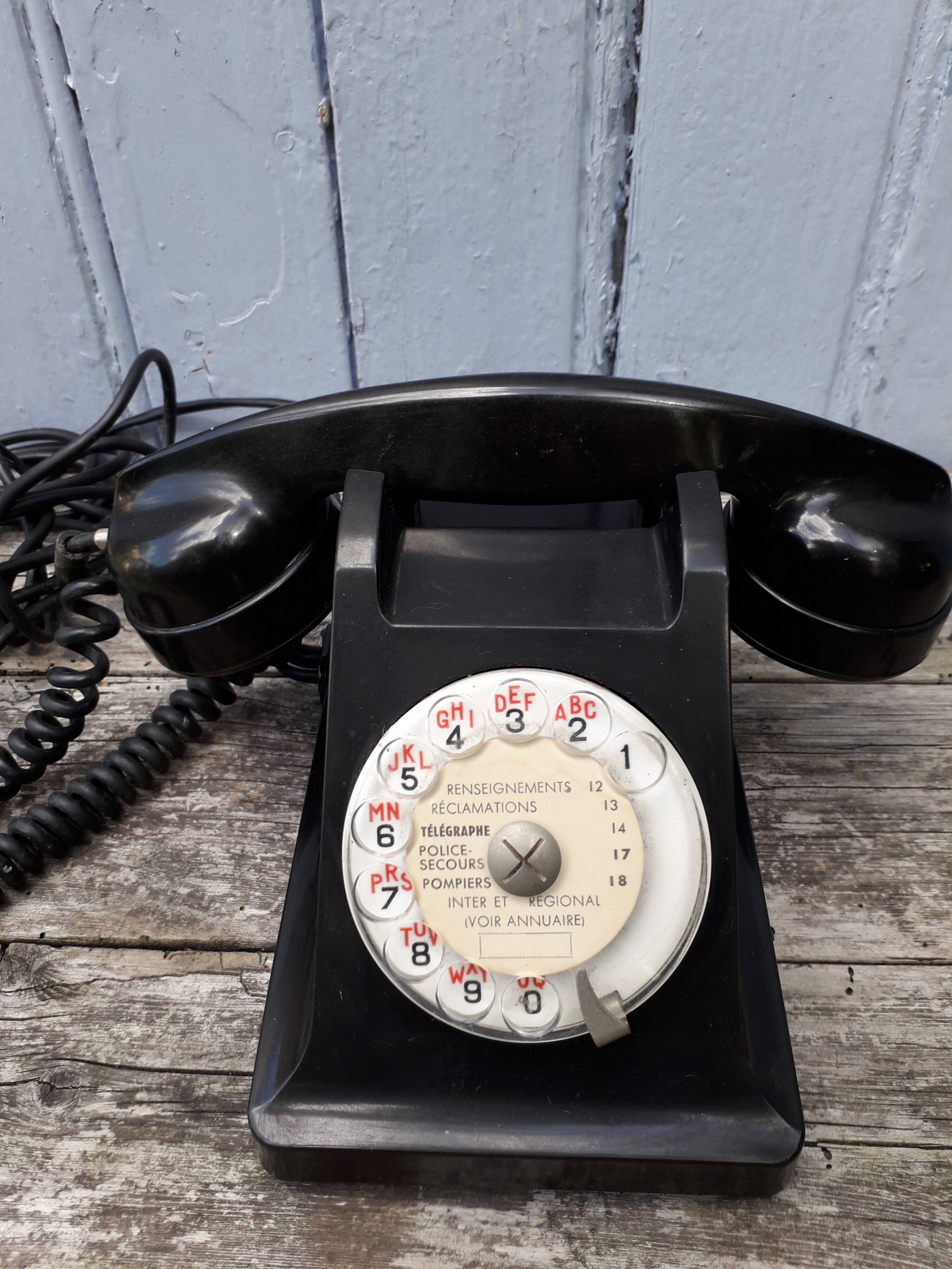 Phone has dial in bakelite
