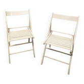 Pair of white wooden folding chairs