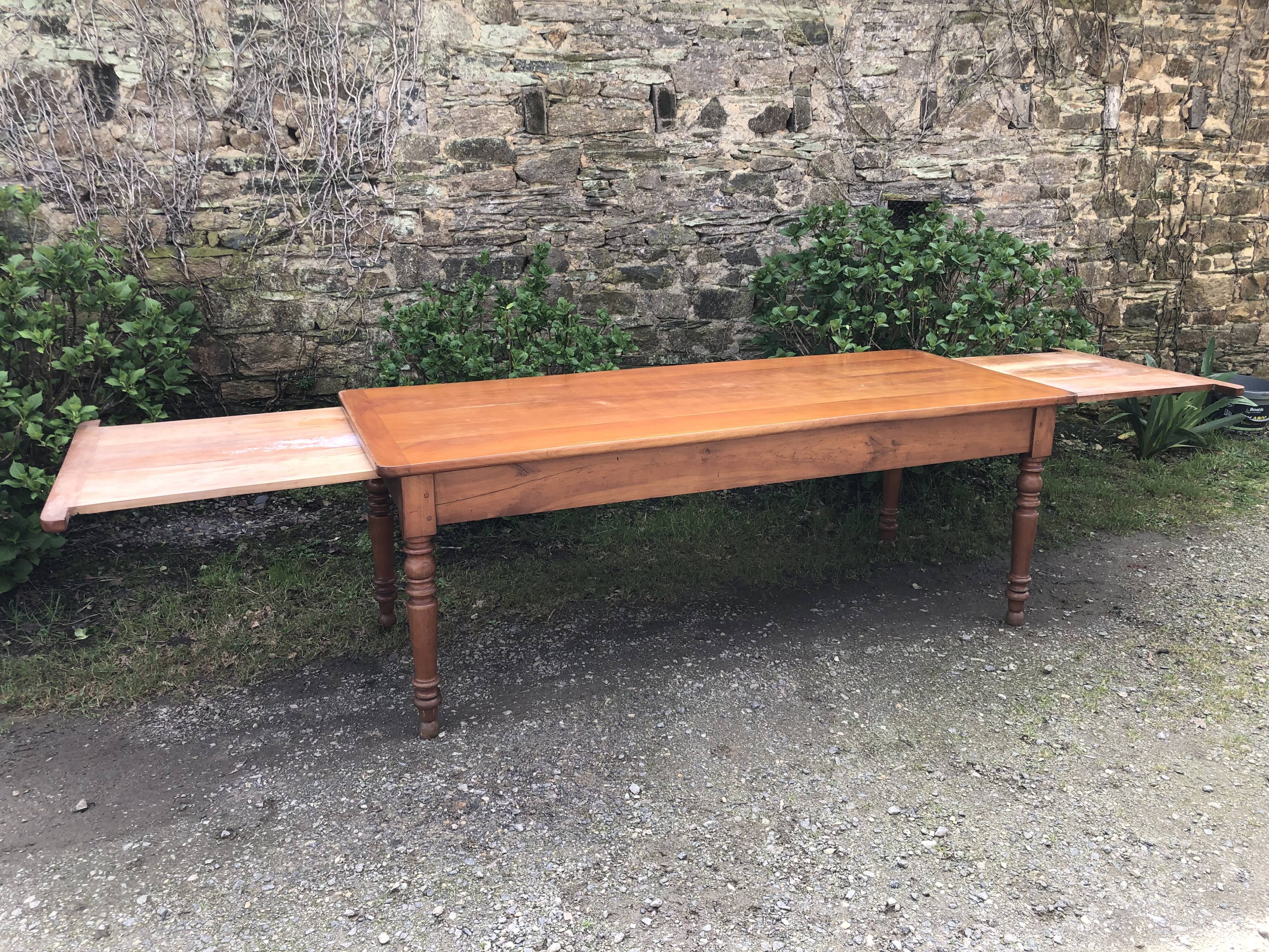 Antique Louis Philippe style farmhouse table in solid cherry wood with its 2 extensions.