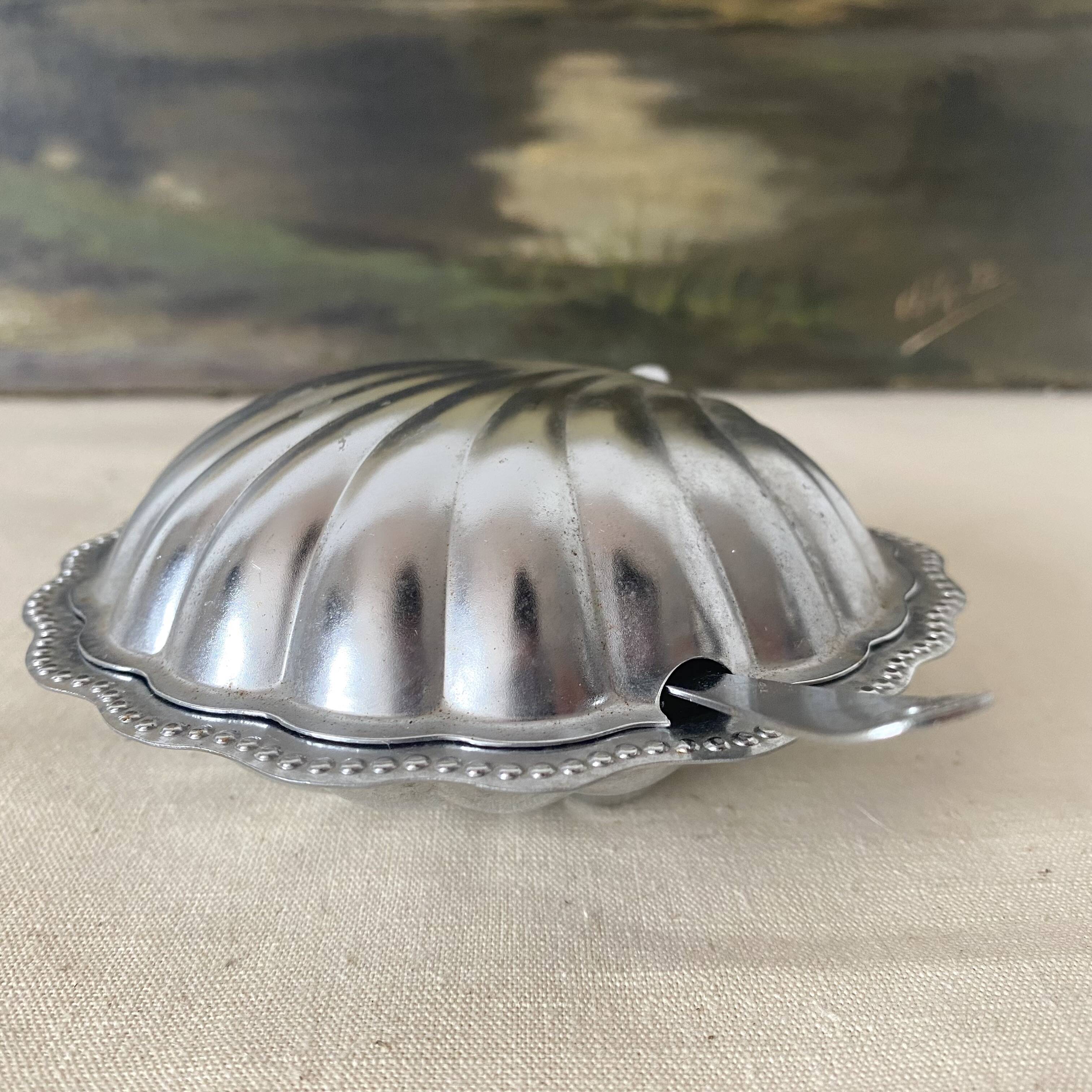 Stainless steel and glass shell butter dish with knife