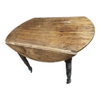 Round console table with folding shutters on copper wheels