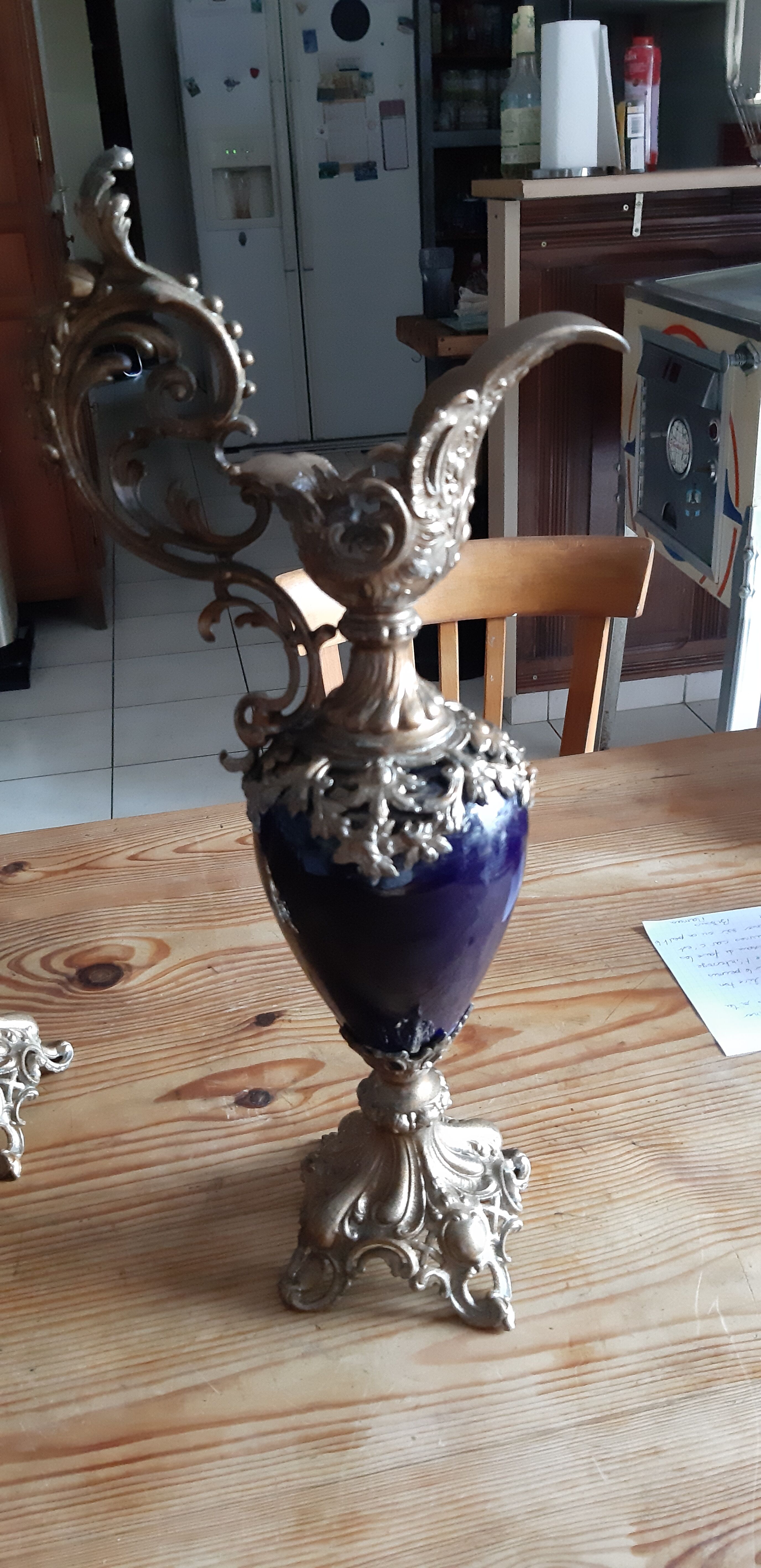 Pair of golden regulated ewers and blue glass