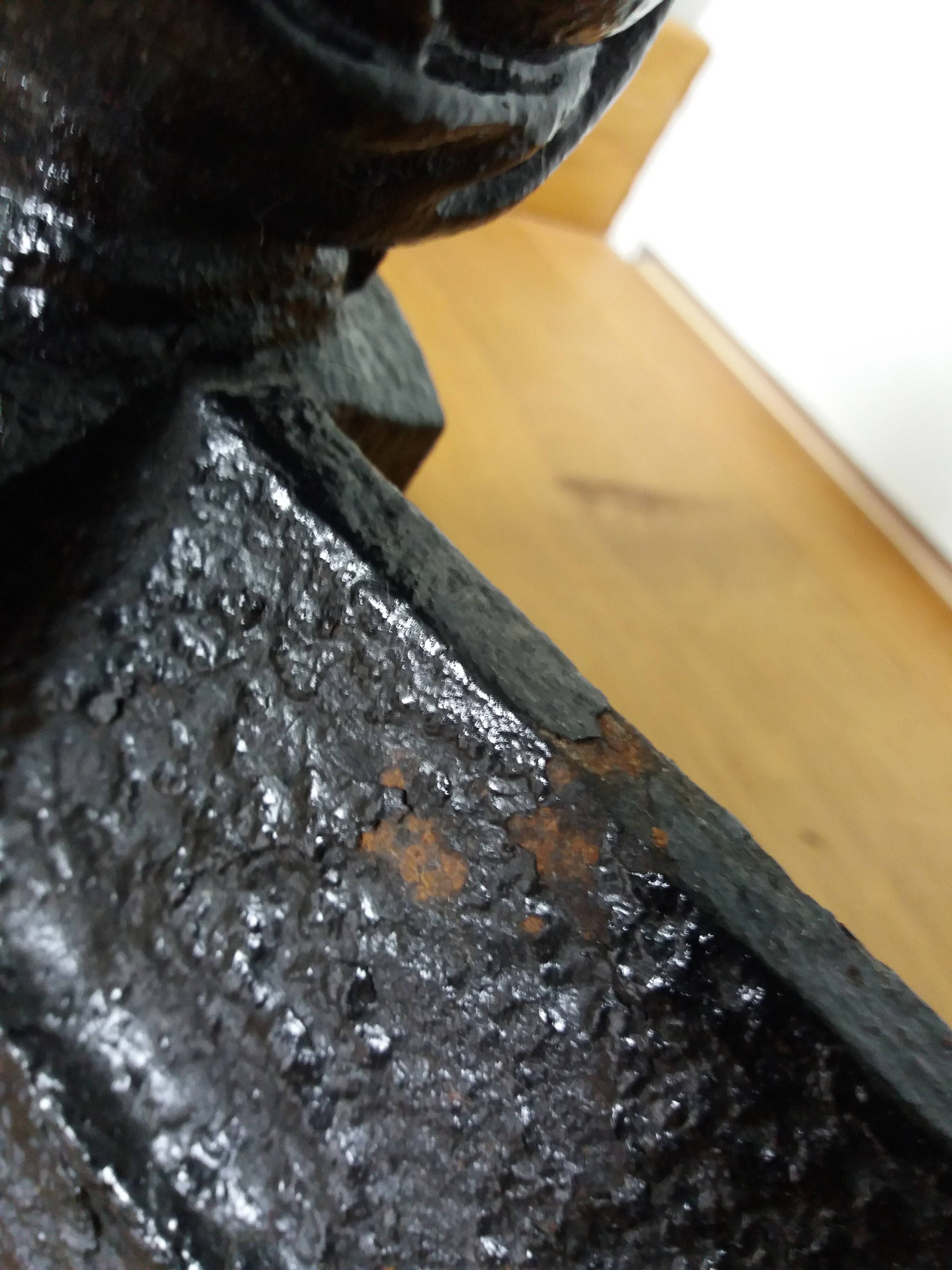 Cast iron andirons with character heads