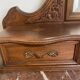 Antique carved wooden dressing table with marble and mirror.