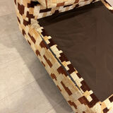 Vintage armchair from the 70s in beige and brown.