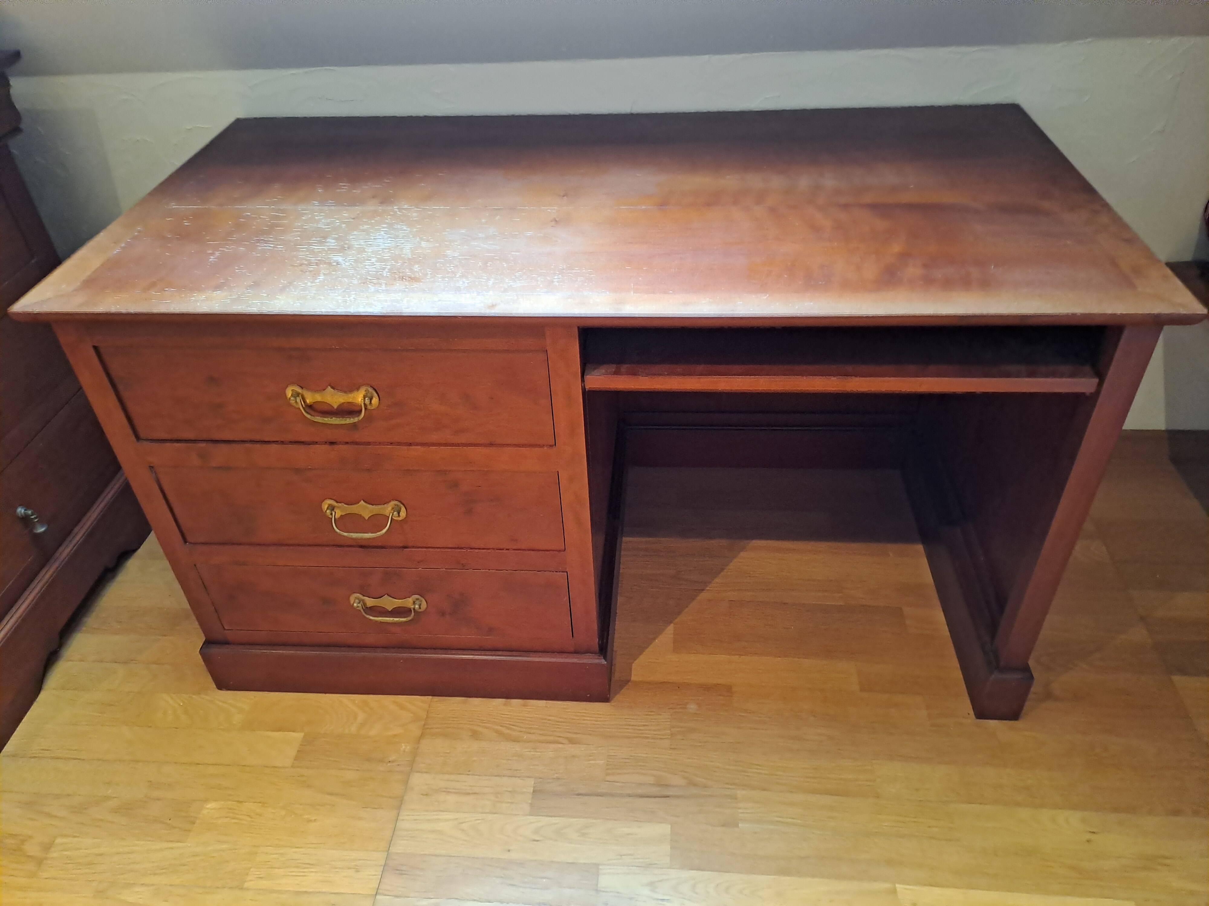 Solid cherry wood desk with 1 block and 3 drawers.