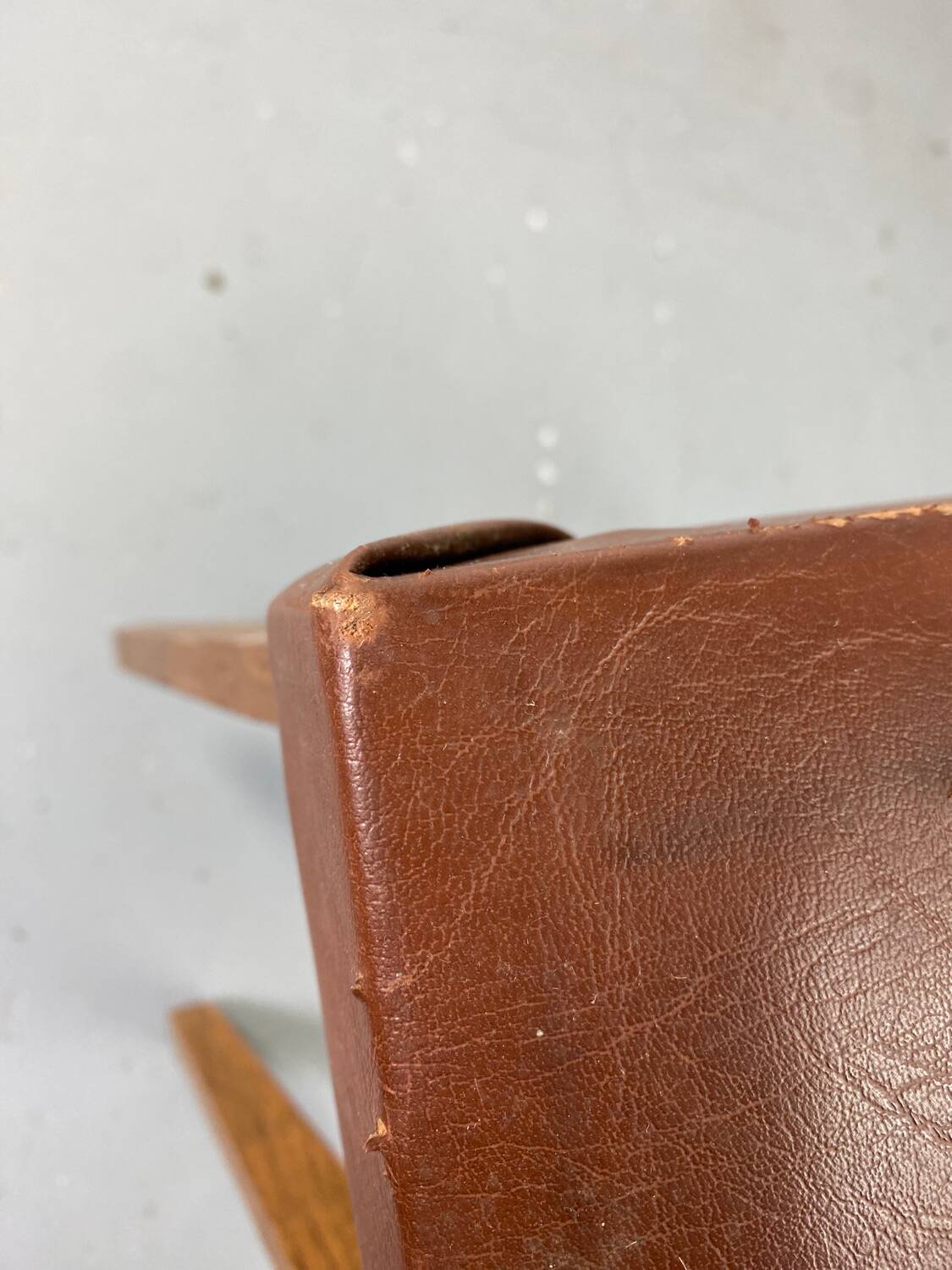 Small stool or footrest in wood and leather