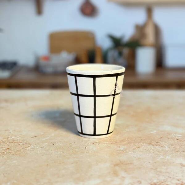 Tisslit glass, handcrafted with a black and white checkered pattern.