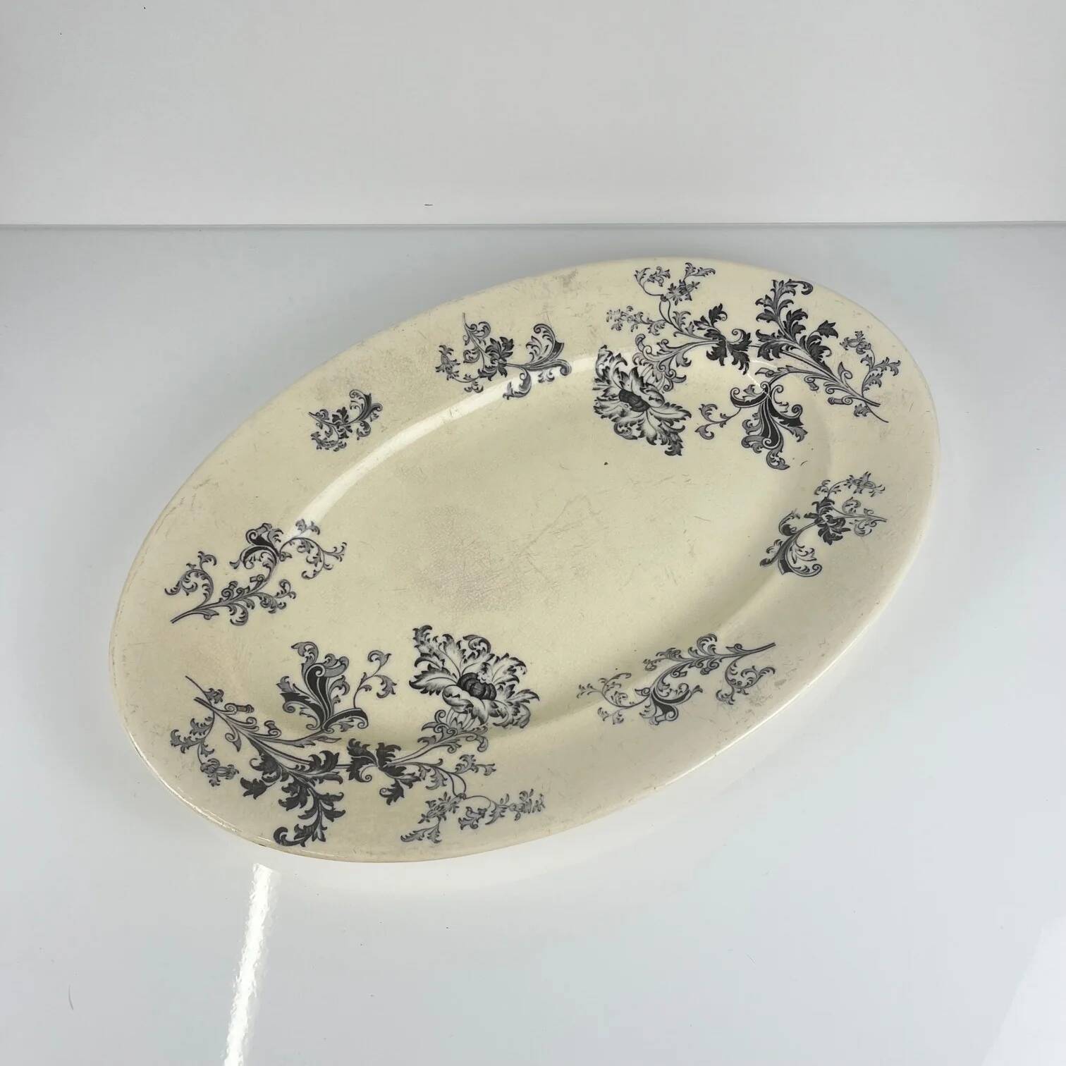 Large oval ironstone dish, "Damas" pattern by Sarreguemines, late 19th century, grey-black.