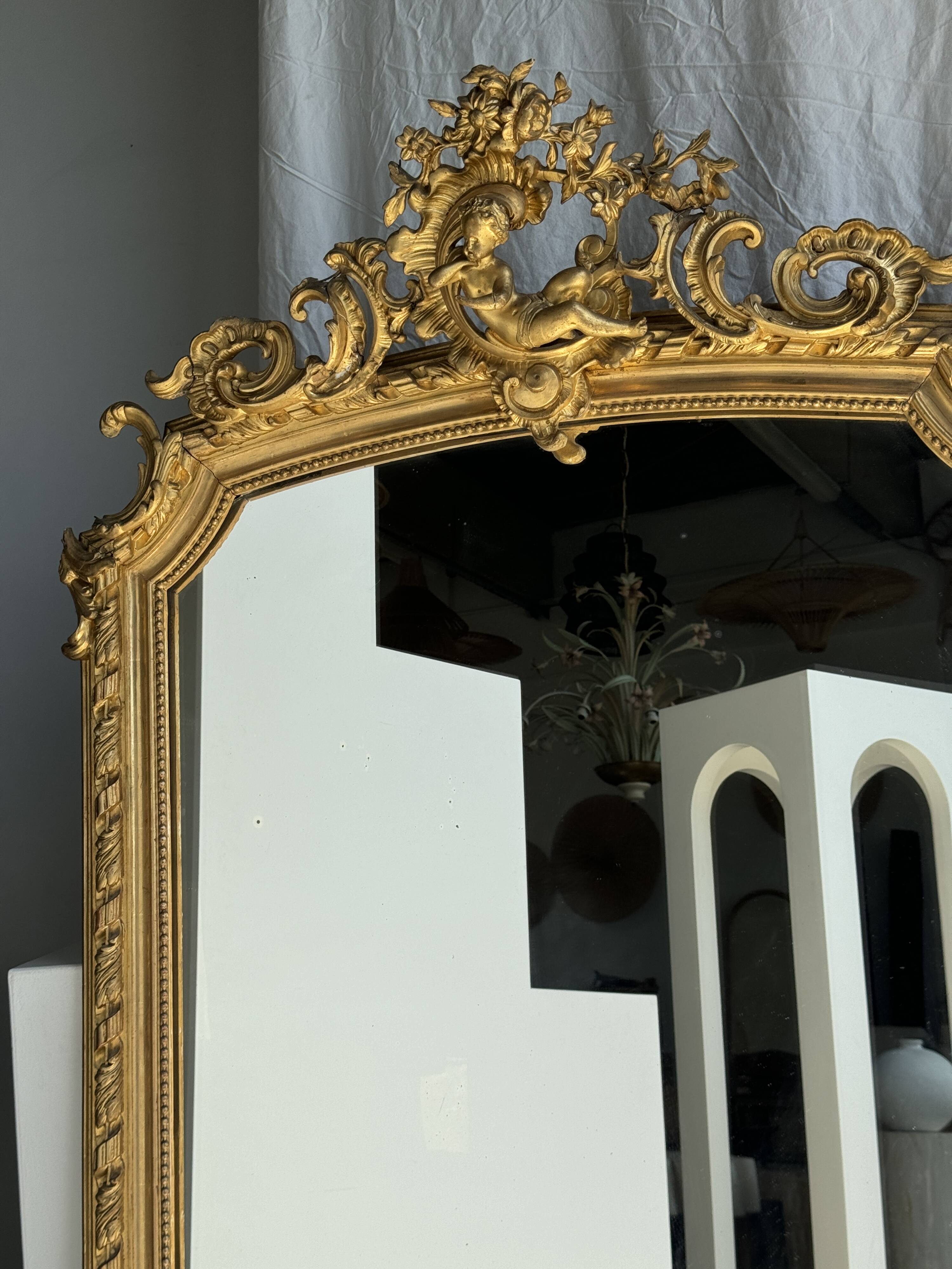 Large gilded mirror with acanthus leaf pediment H150 L98