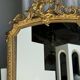 Large gilded mirror with acanthus leaf pediment H150 L98