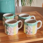 Set of 4 vintage multicoloured slipware coffee cups.
