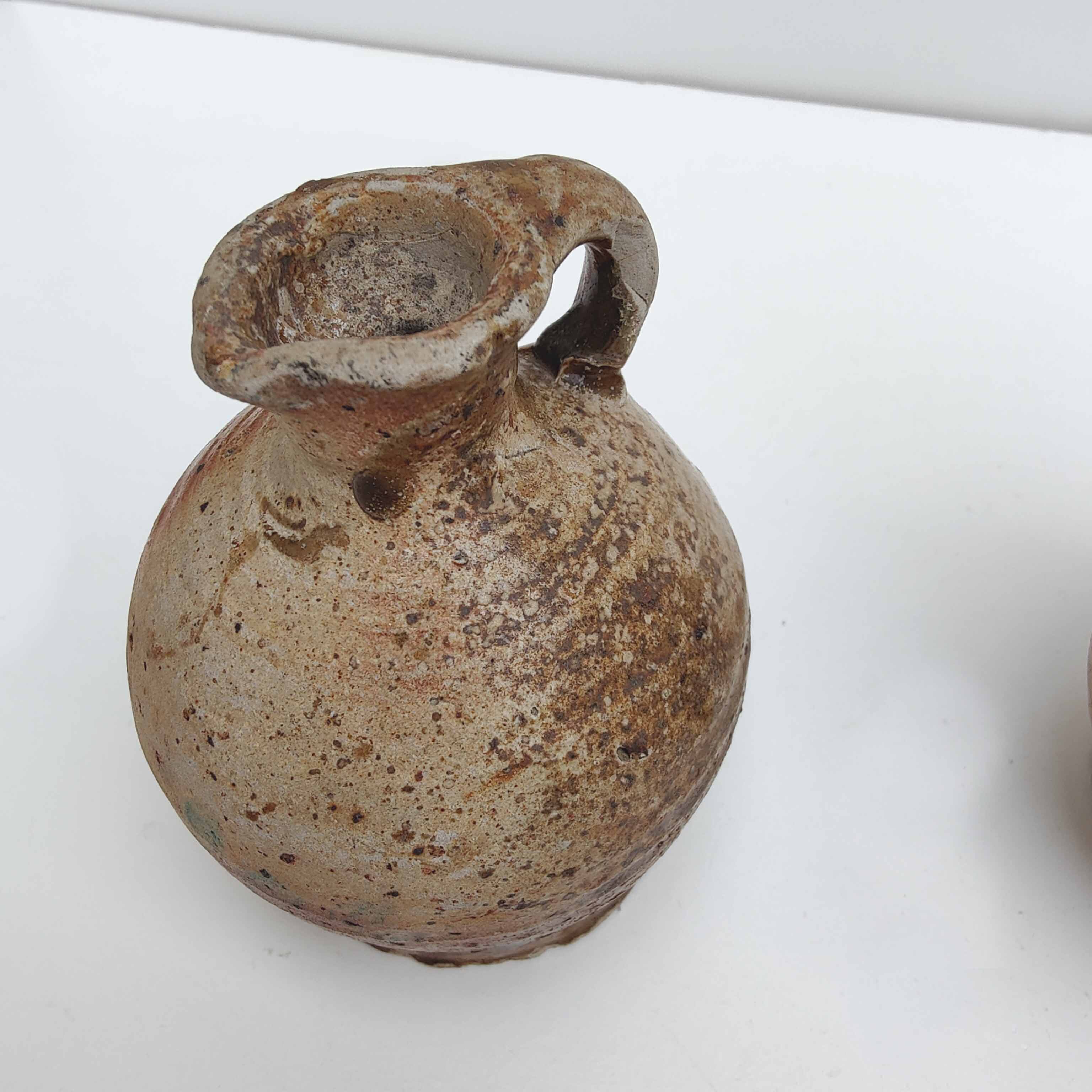 Set of two small sandstone pitchers