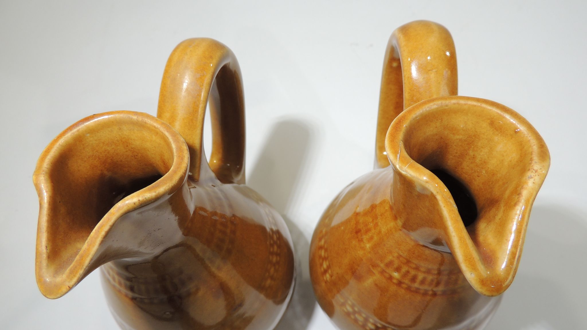 Pair of vintage stoneware pitchers