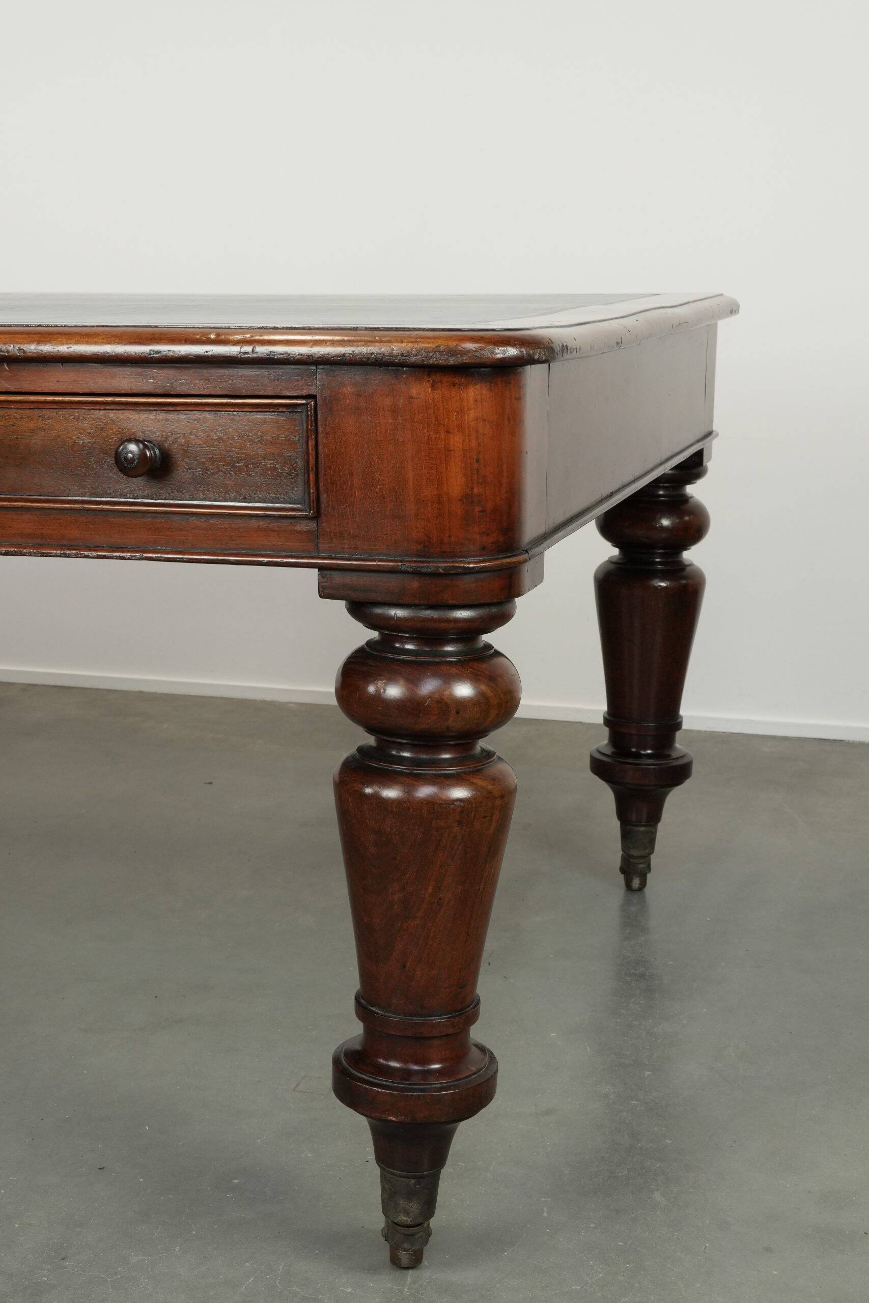 Antique English library table / writing table / desk from the 19th century