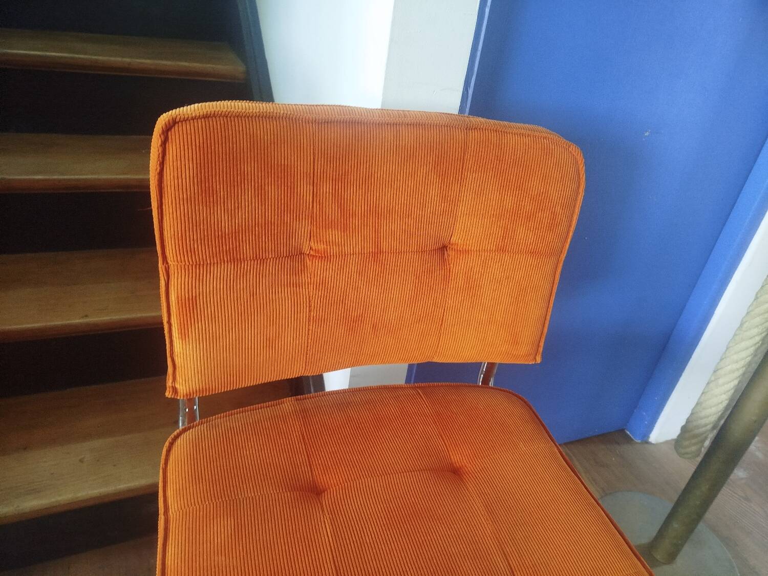 Pair of vintage cantilever chairs in chrome and orange corduroy.