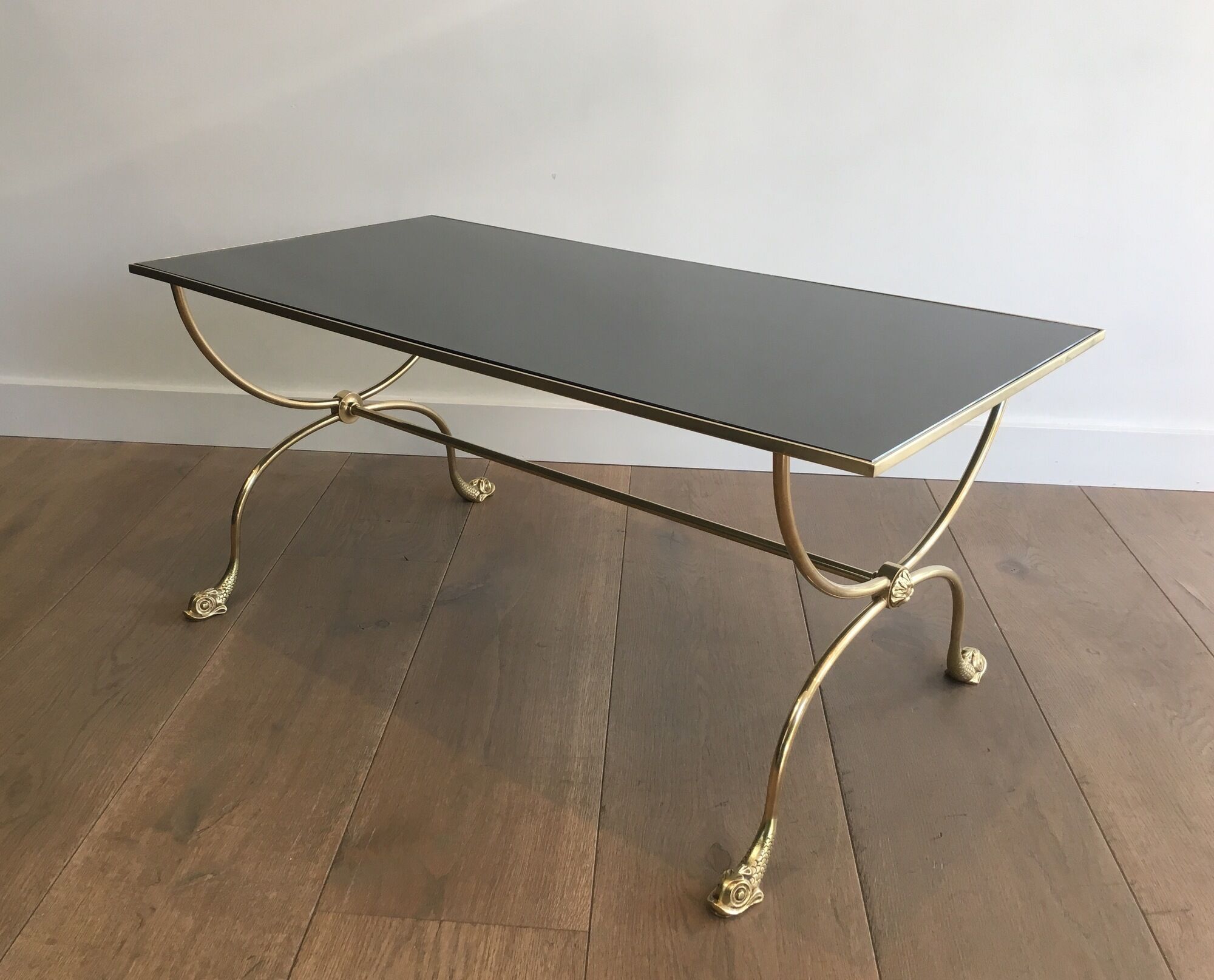 Neoclassical brass style coffee table with dolphin head decoration