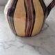 Striped decorative pitcher signed