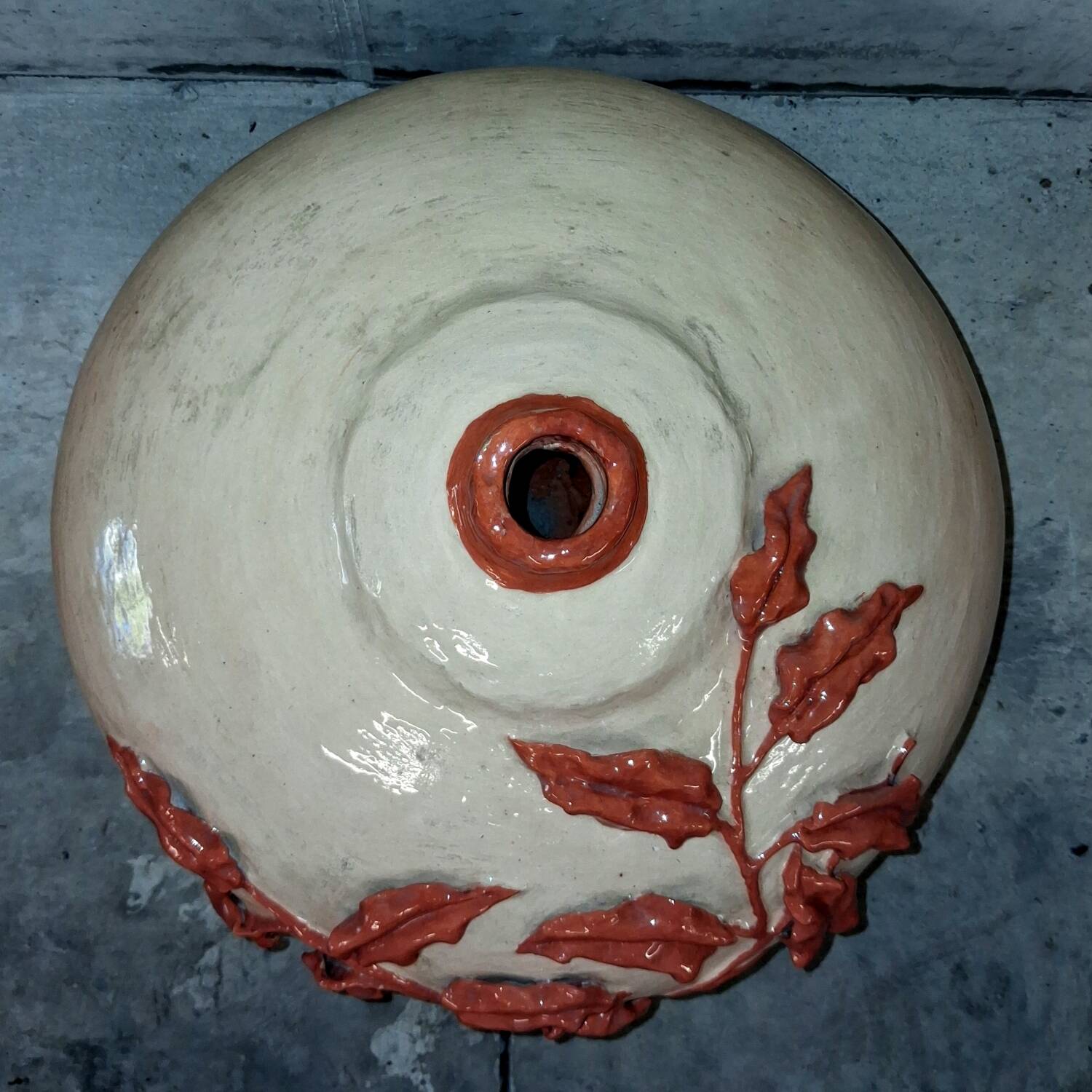 Large vase with relief plant decoration, raw art.