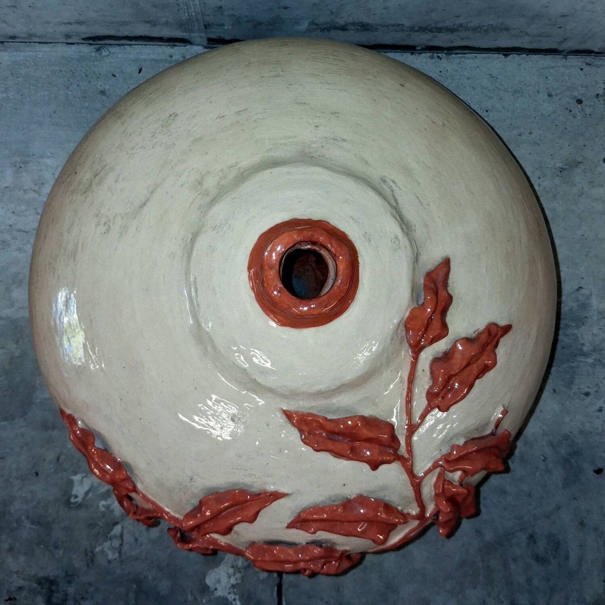 Large vase with relief plant decoration, raw art.