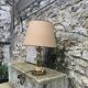 Table lamp in gilded metal, bakelite and antique plexiglass