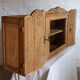 Art-deco wall showcase in raw oak