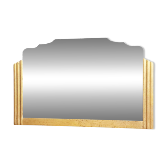 Antique large beveled mercury pediment mirror, art deco, gilded with leaf.